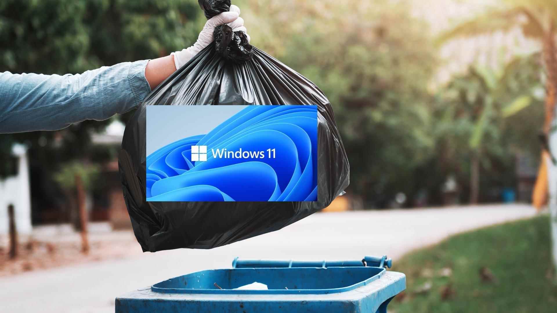 Birisi, Windows 11 markalı bir çöpü çöp kutusuna atıyor.