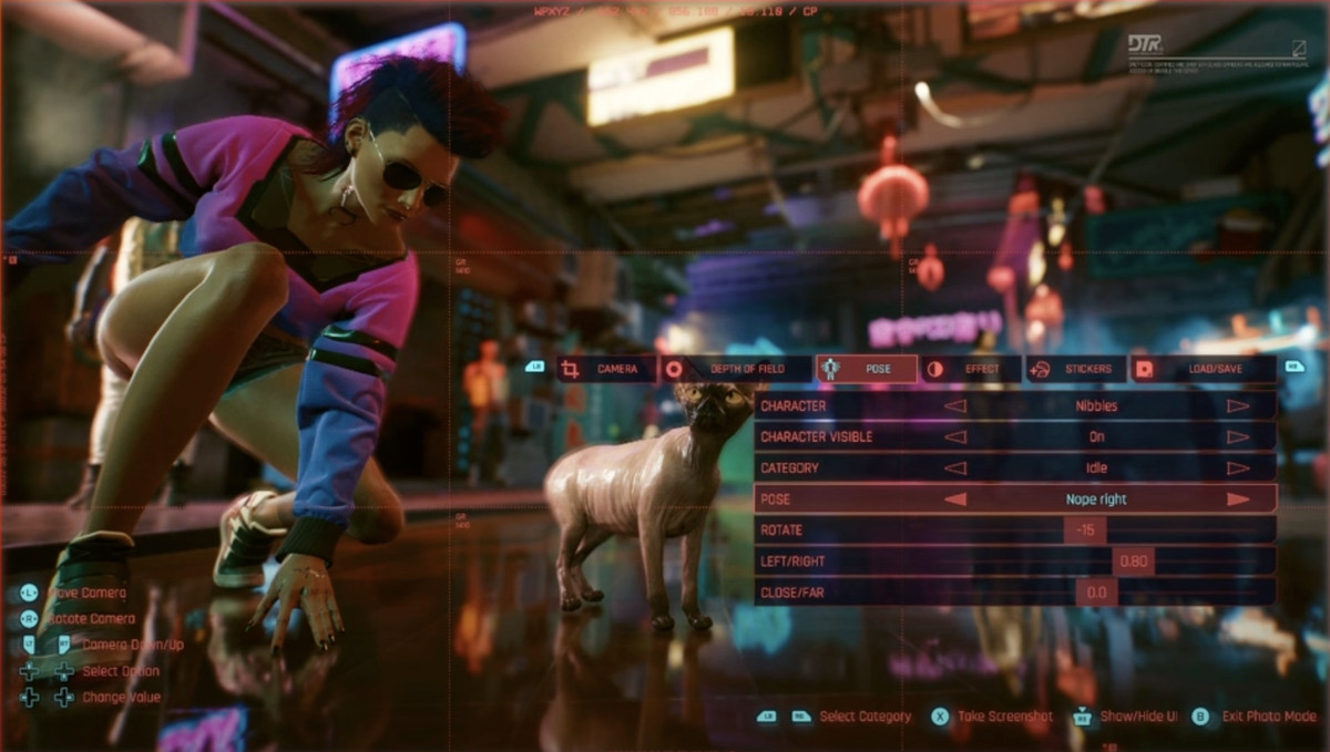 Bir kedinin pozunu ve konumunu değiştirmek için kontrollerle Cyberpunk'ın fotoğraf modunun ekran görüntüsü.