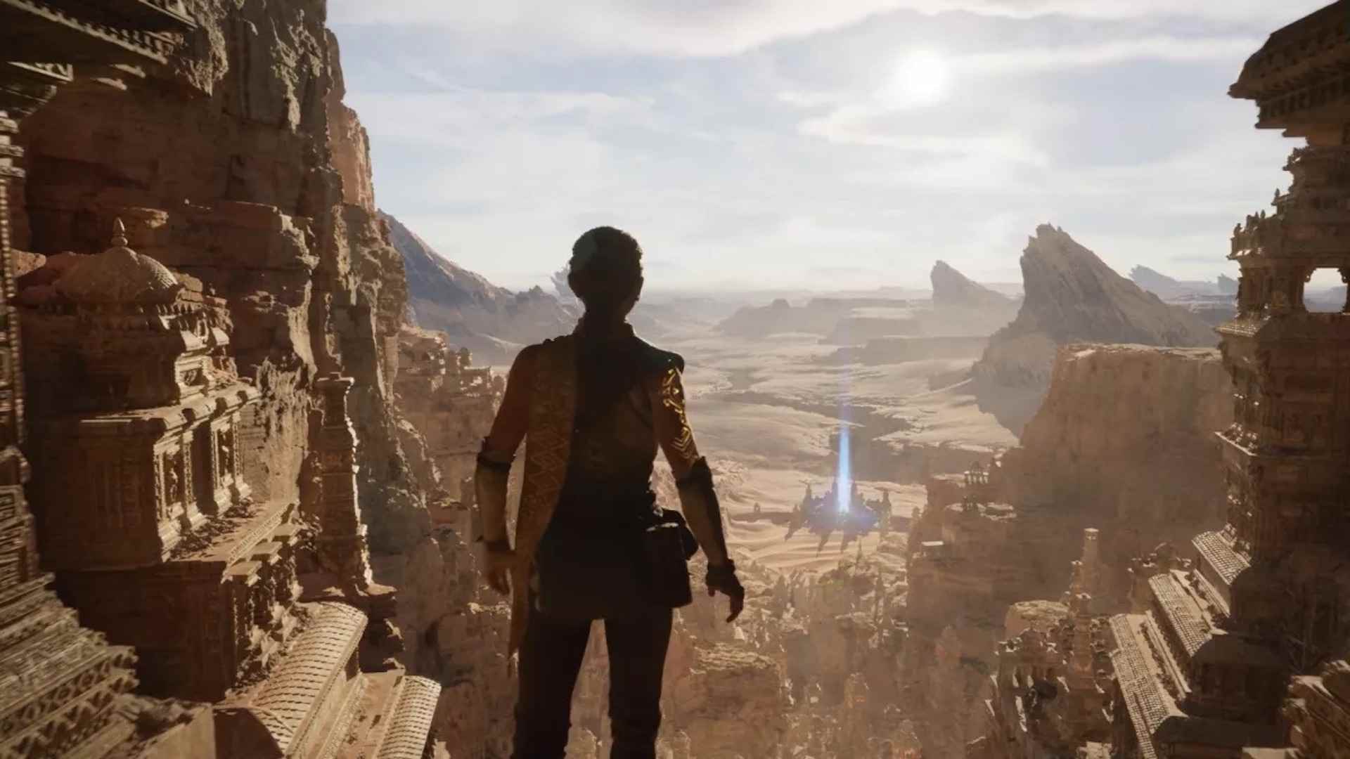 Unreal Engine 5 teknoloji demosundan bir kare.  Bir kadın bir çöl manzarasına bakıyor