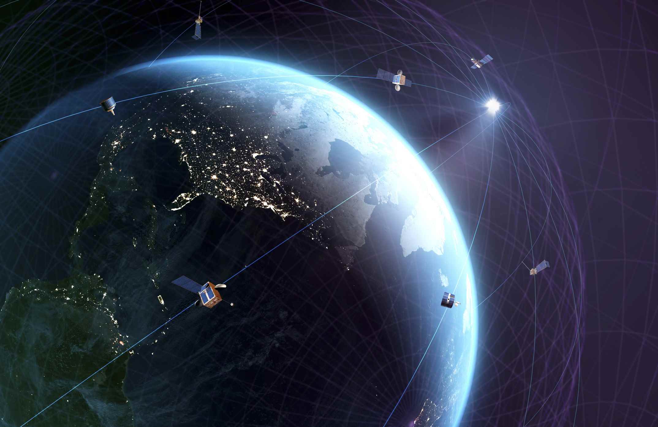 Küresel uydu iletişimi.  Starlink uyduları gibi küresel bir iletişim uyduları ağının kavramsal temsili.