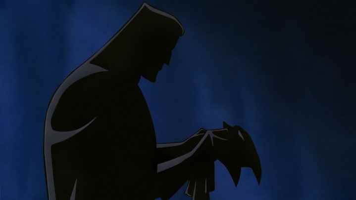 Batman mantosunu giyen Bruce Wayne'in gölgeli silueti.